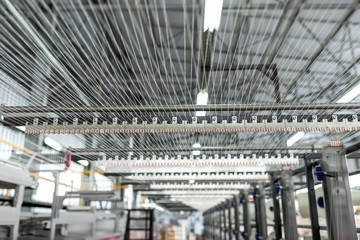 Fototapeta premium Carpet factory, carpet production, synthetic yarns for weaving looms