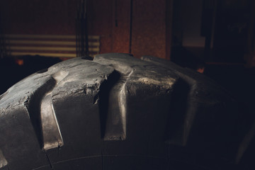 Close up view on several new special huge truck wheel tires for all terrain cars, monster trucks, swamp buggy, tractors. Wide tires with deep protector for off road cars and trucks. © Евгений Вершинин