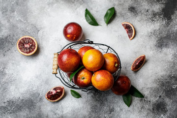 Fresh ripe red oranges on dark background. Healthy orange fruits background many orange fruits. 