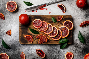 Fresh ripe red oranges on dark background. Healthy orange fruits background many orange fruits. 