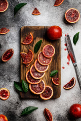 Fresh ripe red oranges on dark background. Healthy orange fruits background many orange fruits. 