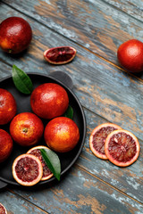 Fresh ripe red oranges on dark background. Healthy orange fruits background many orange fruits. 