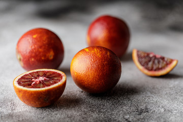 Fresh ripe red oranges on dark background. Healthy orange fruits background many orange fruits. 