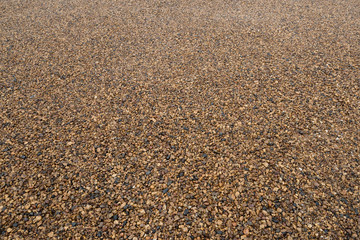 Background of fine gravel or crushed stone in perspective.