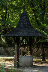 Wooden well with stone base
