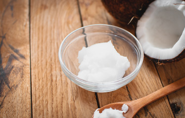 Close-up of coconut oil on wooden board 