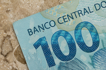 Brazilian currency. Closeup on marble table.