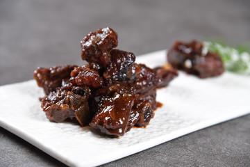 dried dates on a plate isolated on white