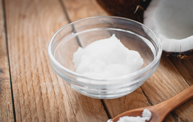 Close-up of coconut oil on wooden board 