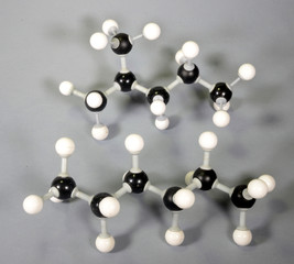 Molecule model of the isomer isohexane and hexane. Both have same amount of molecules (C6H14) but are still very different.