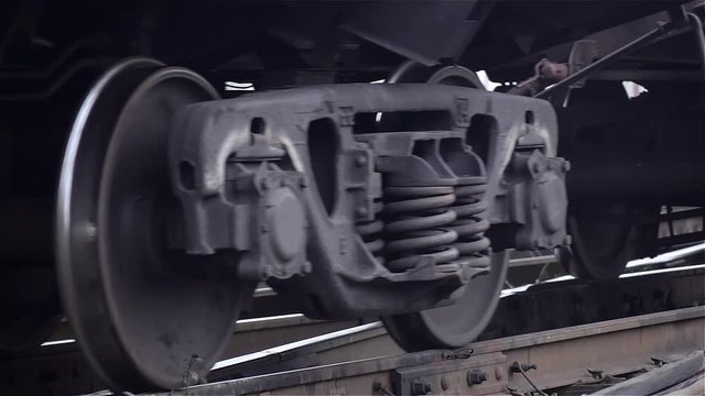 Close-ups of steel diesel railcar train bogie wheels
