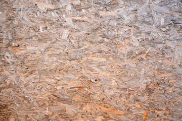 OSB boards compressed sawdust or chipboard. Abstract texture background compressed sawdust or pressed wooden panel.