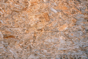 OSB boards compressed sawdust or chipboard. Abstract texture background compressed sawdust or pressed wooden panel.