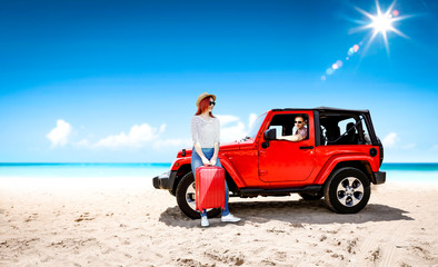 Fototapeta premium Red summer car on beach and two lovers. Two people and summer background of beach. 