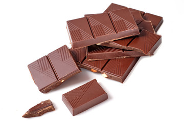 Chocolate pieces with almonds on white background