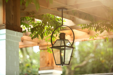 Upscale Luxury Outdoor Hanging Patio Classic Lantern  Lighting with a burning flame with curb appeal