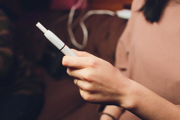 Newest electronic cigarettes, heating tobacco system IQOS, smoking.