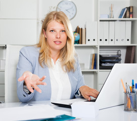 Female business consultant sitting at workplace