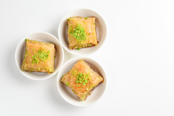 Pistachio baklava on a white background. Dessert.