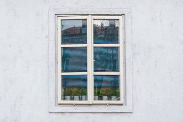 Fototapeta na wymiar white window on gray wall