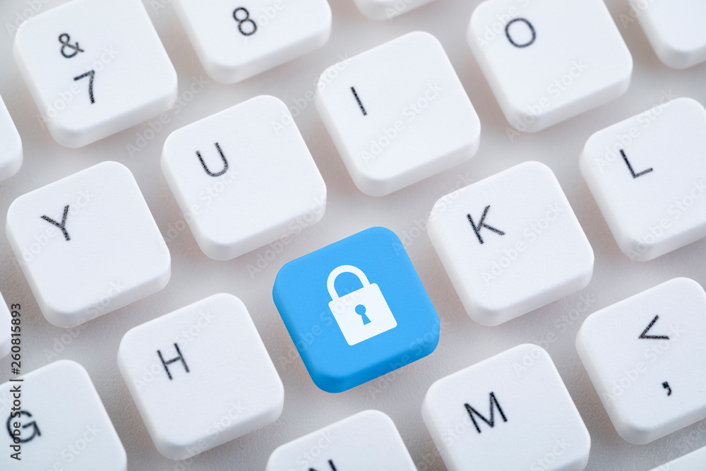 Poster computer keyboard with blue lock button. computer security concept.