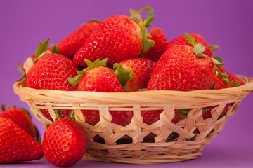 beautiful and big strawberries. strawberries in a wooden basket