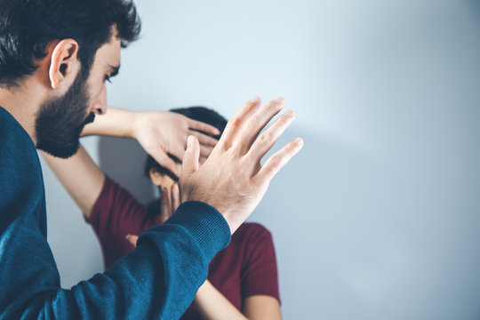 Angry Man Beat Young Sad Woman