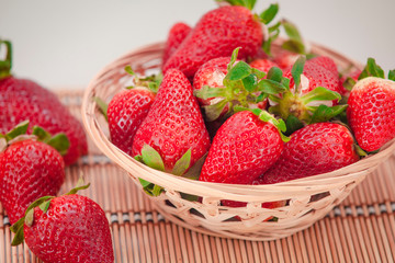 beautiful and big strawberries. strawberries in a wooden basket