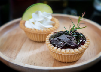 Mini fruits and cream pie tarts.