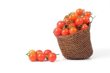 Small Tomato spill out of basket.Food concept.