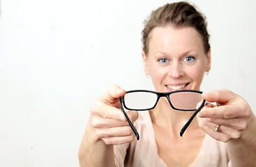 woman holding glasses on display with white background stock photo