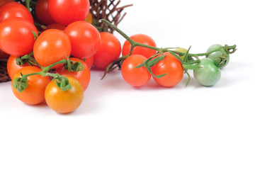 Small Tomato on white background.Food concept.