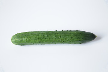 fresh green cucumber isolated on white background. Flat lay. Top view. With copy space for text.