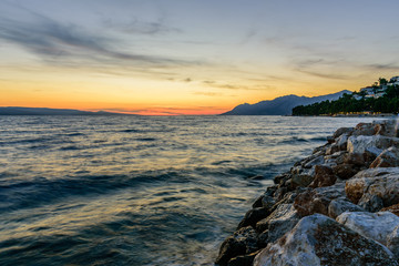 Beautiful sunset at the sea. Tourist village Baška Voda, Dalmatia region, Croatia