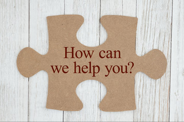 How can we help you text on a cardboard puzzle piece