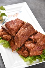 grilled beef steak with vegetables on plate isolated on white