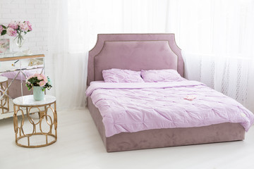 one double bed. bedroom with a large bed. interior. bed with soft headboard