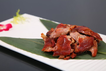 grilled chicken with sauce on white plate