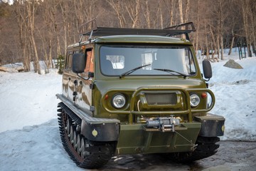 Dombay, Karachay-Cherkess Republic, Russia, 08/04/2019, UAZ SUV converted to a snowmobile tracked all-terrain vehicle