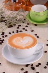 cup of coffee and cookies on wooden table