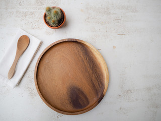Plastic free and eco friendly bamboo cutlery and plate on a white table top