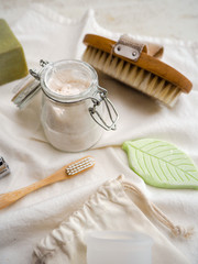 Set of eco friendly toiletries and bathroom products such as bamboo toothbrush, body brush and homemade toothpaste