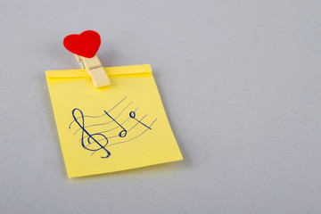 treble clefs and music notes. Yellow note on the fridge. Blank paper reminder. Notes. Notebook for...