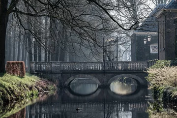 Printed roller blinds Mysterious bridge reflected in water on a foggy morning  in Laren, Netherlands