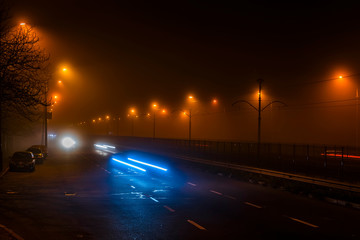 Fototapeta na wymiar A night city in a dense fog