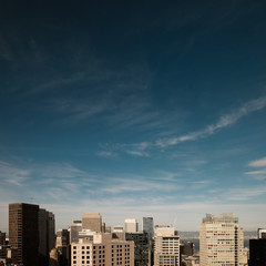 Fototapeta na wymiar City under a blue sky