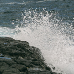 waves crashing on rocks