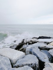 Ligurian sea. Marina di Pisa, Italy. Region Toscana. View on the sea and stones