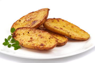 Homemade baked potato wedges, fry potatoes, close-up, isolated on white background