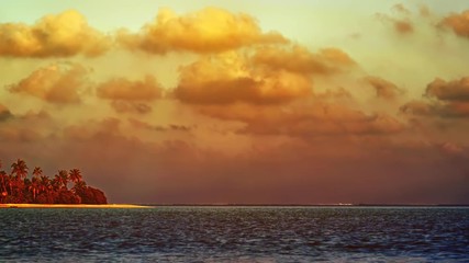 Sunset in Exotic Colors over Tropical Island in the Maldives
